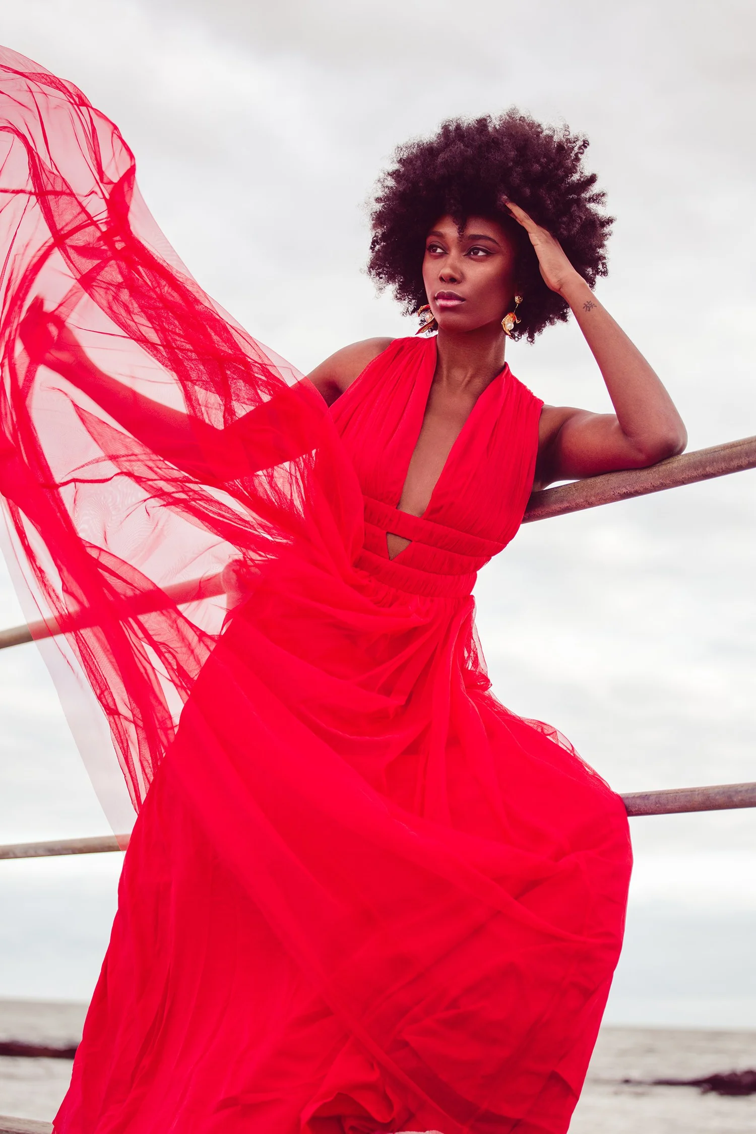 Editorial fashion frame in a coral suit